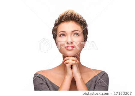 Praying woman with copper-colored hair looking up Praying woman with copper-colored hair looking up 17133207