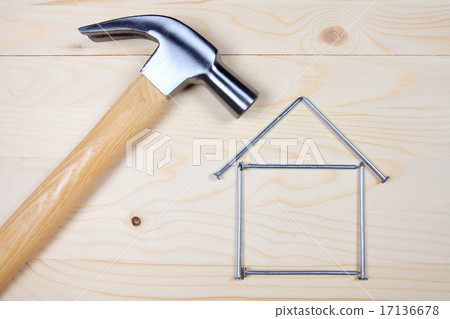 Hammer and nails on wooden background Hammer and nails on wooden background 17136678
