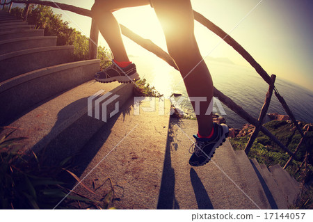 fitness woman runner legs running on seaside   17144057