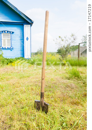 Old metal shovel on the ground in the garden 17147219