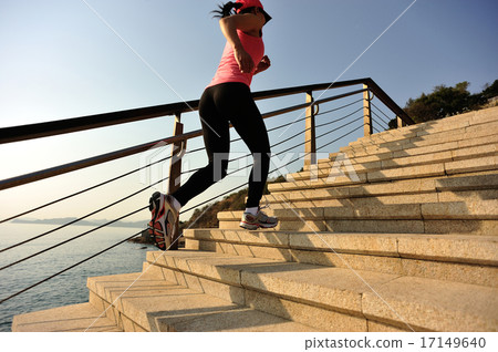 sports woman running on stone stairs   17149640
