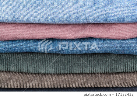 stack of different denims close up 17152432