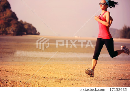 young healthy lifestyle woman running at beach 17152685