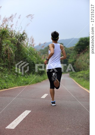 young fitness woman runner running on trail young fitness woman runner running on trail 17155217