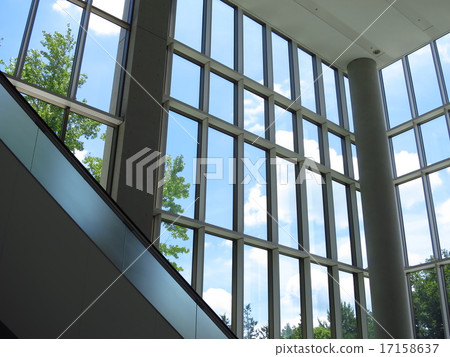 A blue sky visible from the building window 17158637
