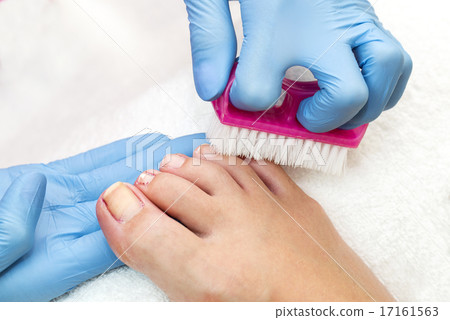 process of pedicure at beauty salon spa 17161563