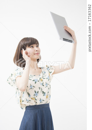 A woman with a tablet A woman with a tablet 17163362