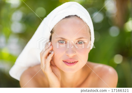 a woman preparing herself for spa day 17166321