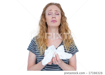 Sick blonde woman holding paper tissue Sick blonde woman holding paper tissue 17166328