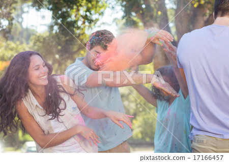 Friends throwing powder paint 17166457