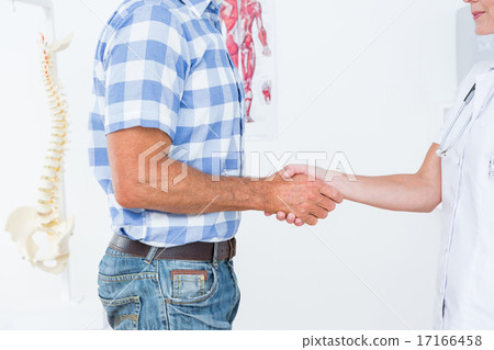 Patient shaking hands with doctor 17166458