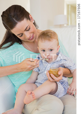 Happy mother eating with her baby boy 17167806