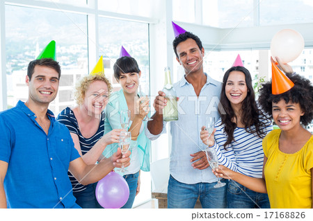 Business people toasting with glasses of champagne Business people toasting with glasses of champagne 17168826