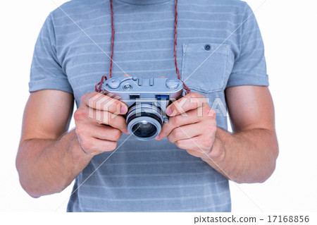 Close up view of man holding photo camera 17168856