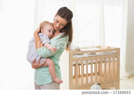 Happy mother holding baby boy 17169055