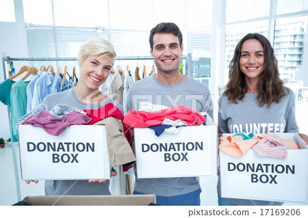 Volunteers friends holding donation boxes 17169206