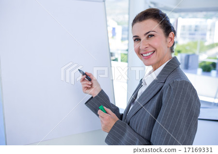 Happy businesswoman looking at camera 17169331