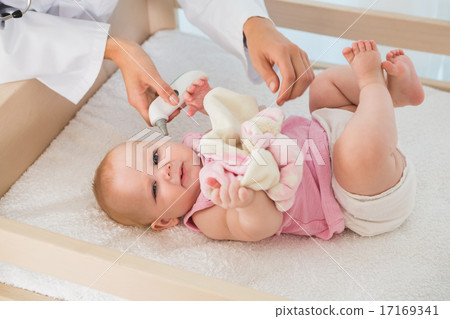 Beautiful cute baby girl with doctor taking temperature Beautiful cute baby girl with doctor taking temperature 17169341