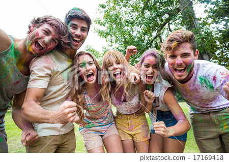 Happy friends throwing powder paint Happy friends throwing powder paint 17169418