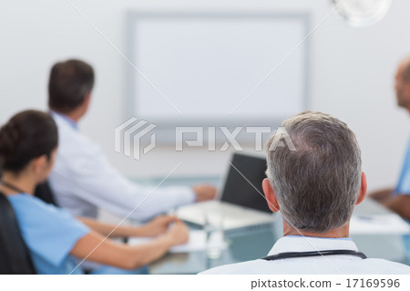 Doctors looking at white board 17169596