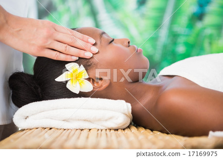 Pretty woman enjoying a head massage Pretty woman enjoying a head massage 17169975