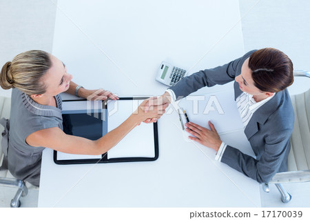 Businesswomen shaking hands Businesswomen shaking hands 17170039
