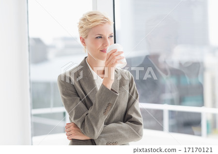 Thoughtful businesswoman looking away Thoughtful businesswoman looking away 17170121