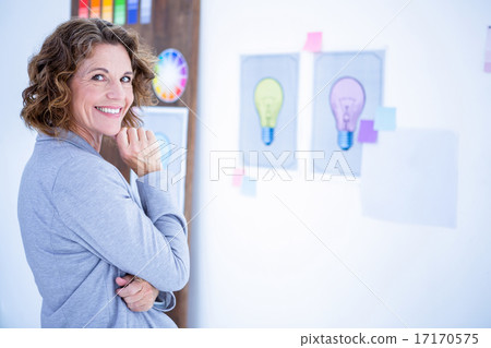 Creative businesswoman looking at camera Creative businesswoman looking at camera 17170575