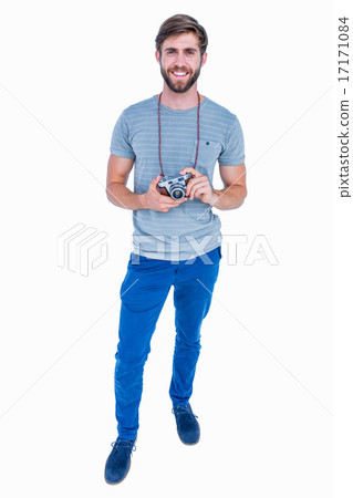 Happy handsome man looking at camera and holding photo camera 17171084