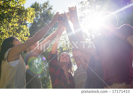 Happy friends in the park having beers Happy friends in the park having beers 17171433