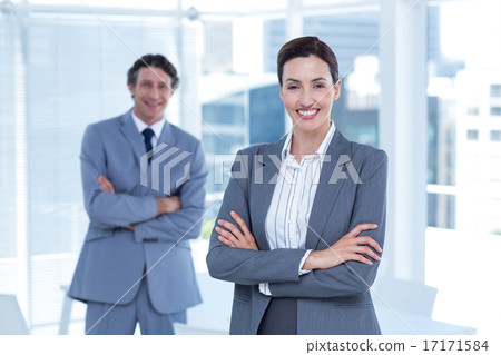 Smiling business people with arms crossed 17171584