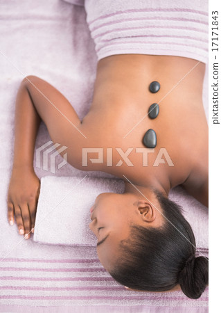 Pretty woman enjoying a hot stone massage 17171843
