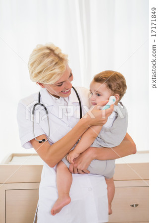 Smiling blonde doctor with child and stethoscope 17171849