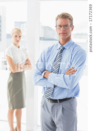 Business partners looking at camera Business partners looking at camera 17172369