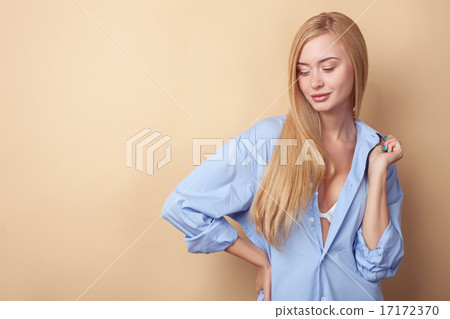 Attractive young woman is seducing in male clothing Attractive young woman is seducing in male clothing 17172370