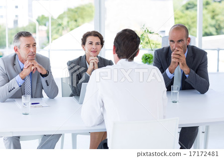 Interview panel listening to applicant Interview panel listening to applicant 17172481