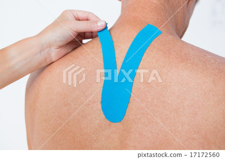 Doctor examining her patient back 17172560