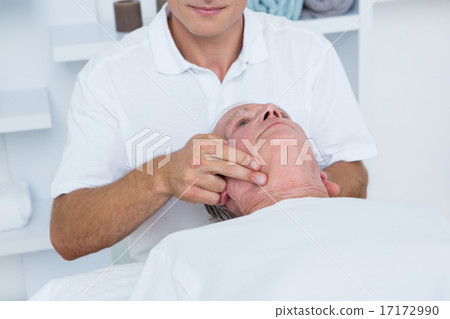 Man receiving head massage Man receiving head massage 17172990
