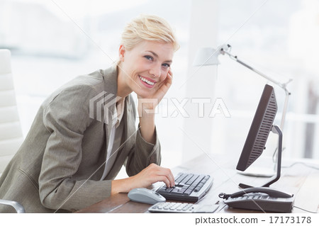 Smiling businesswoman looking at camera Smiling businesswoman looking at camera 17173178