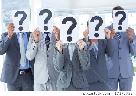 Business colleagues hiding their face with question mark sign 17173752