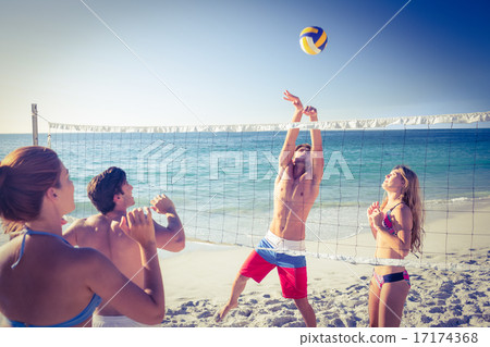 Friends playing volleyball Friends playing volleyball 17174368