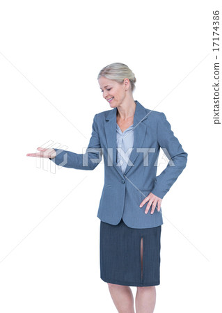 Smiling businesswoman presenting with hand 17174386