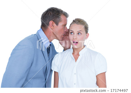 Businessman telling secret to a businesswoman 17174497