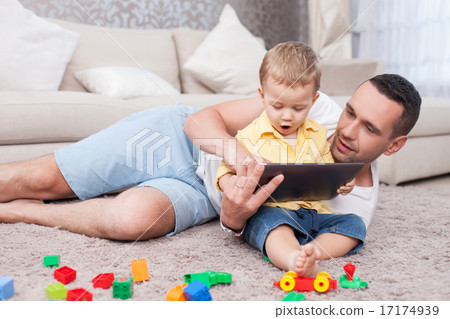 Cute family is using a laptop for fun Cute family is using a laptop for fun 17174939