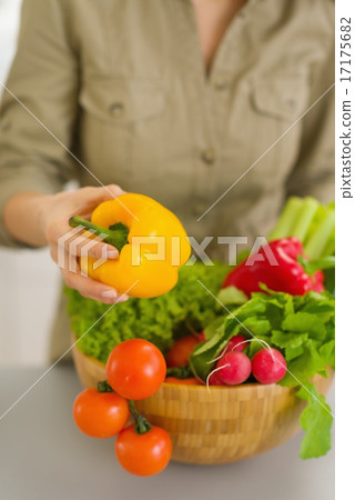 Closeup on woman with plate of fresh vegetables 17175682