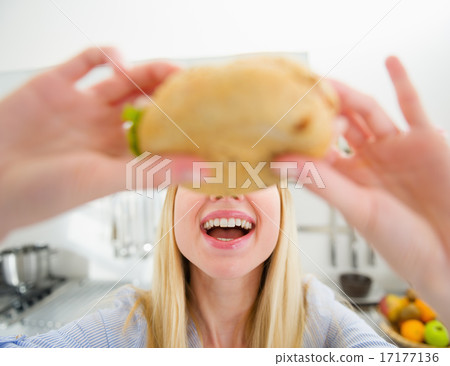 Closeup on teenager girl eating sandwich Closeup on teenager girl eating sandwich 17177136