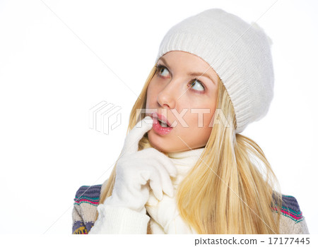 Thoughtful young woman in winter clothes looking on copy space Thoughtful young woman in winter clothes looking on copy space 17177445