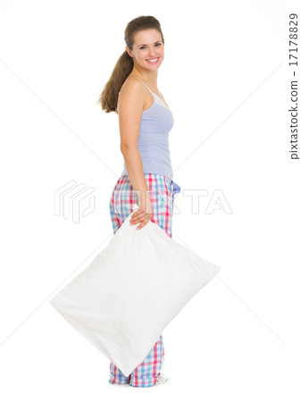 Full length portrait of young woman in pajamas with pillow Full length portrait of young woman in pajamas with pillow 17178829
