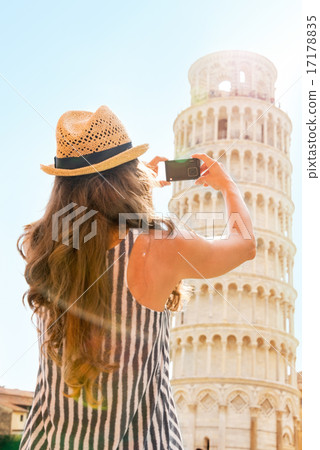 Young woman taking photo of leaning tower of pisa, tuscany, ital Young woman taking photo of leaning tower of pisa, tuscany, ital 17178835