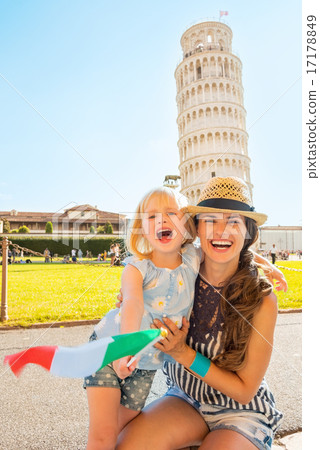 Portrait of smiling mother and baby girl with italian flag in fr 17178849